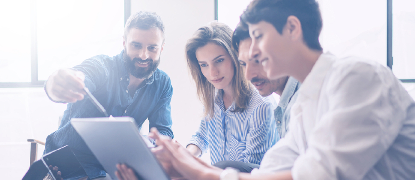 group of people understanding financials on tablet
