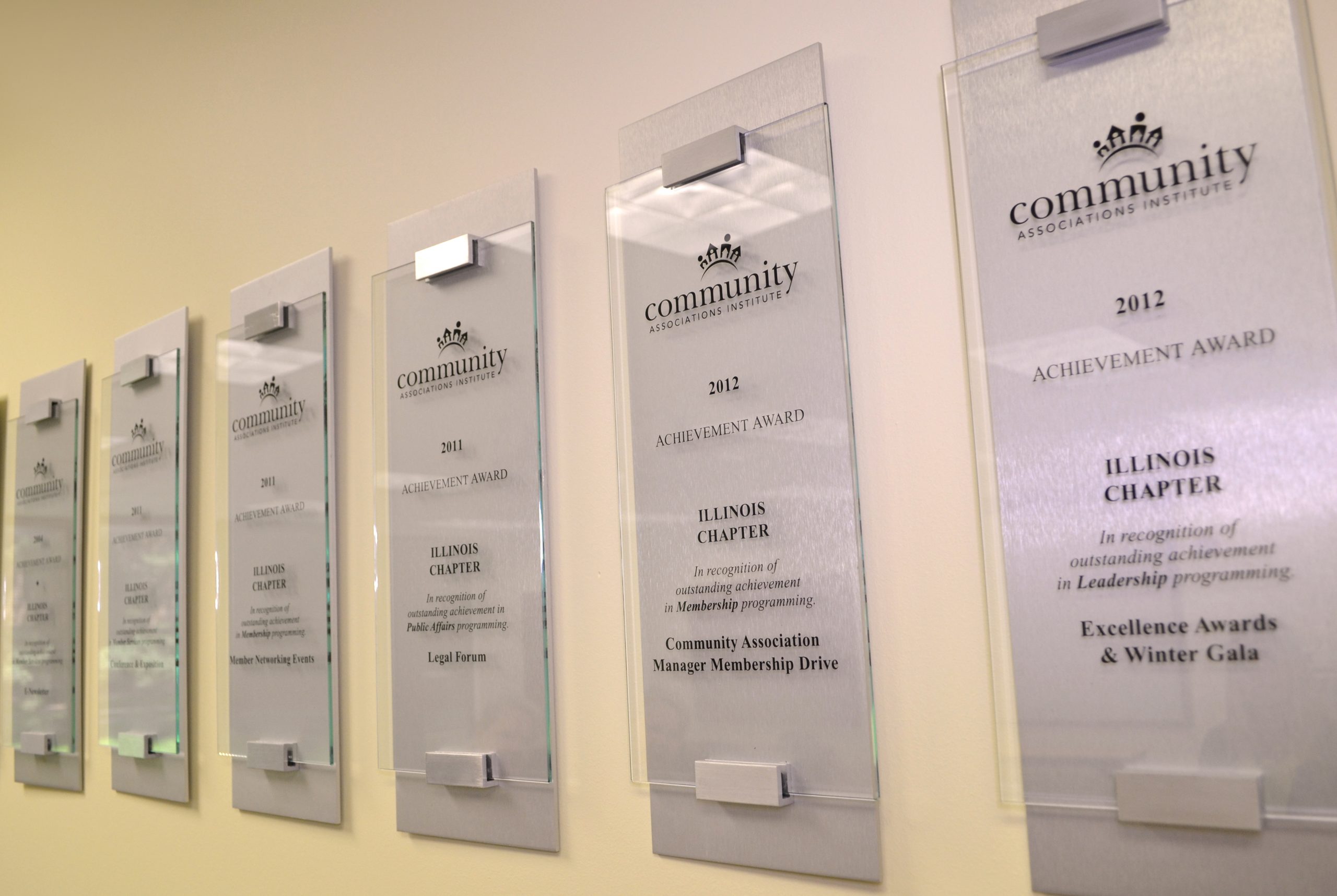 CAI Illinois achievement awards hanging up on wall