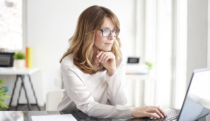 woman doing research on laptop