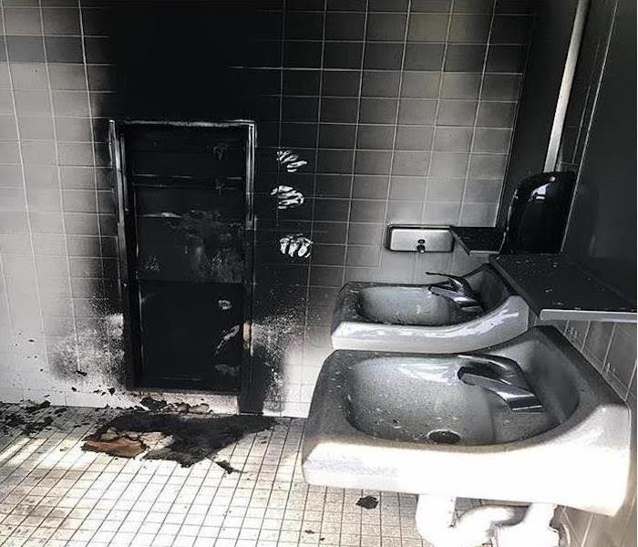 fire damage inside bathroom before servpro evergreen chicago service