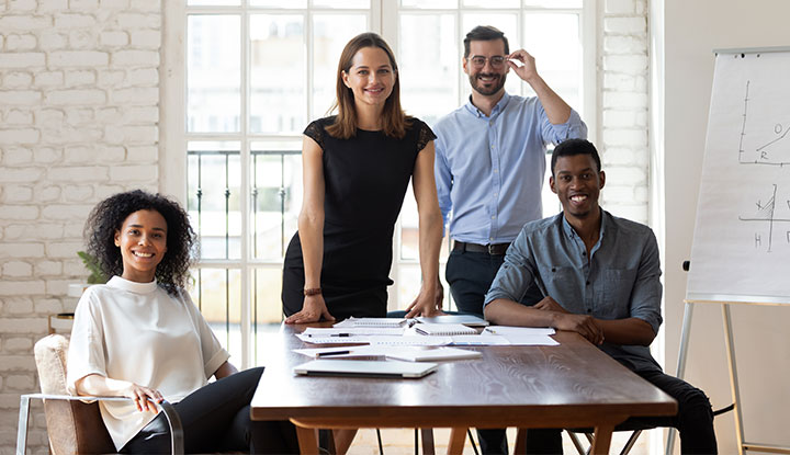 group of business men and women at table