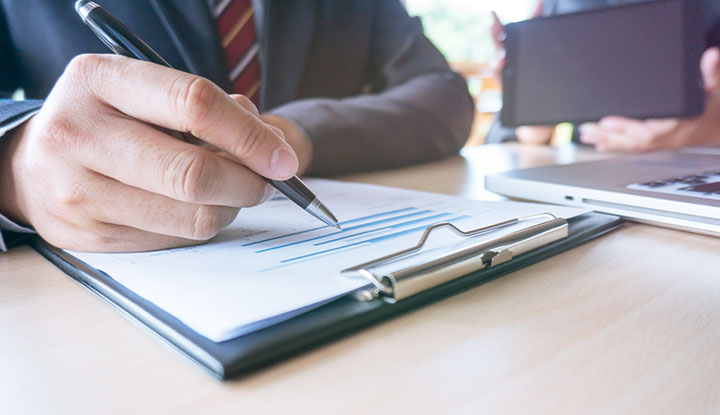community association manager reviewing legal documents