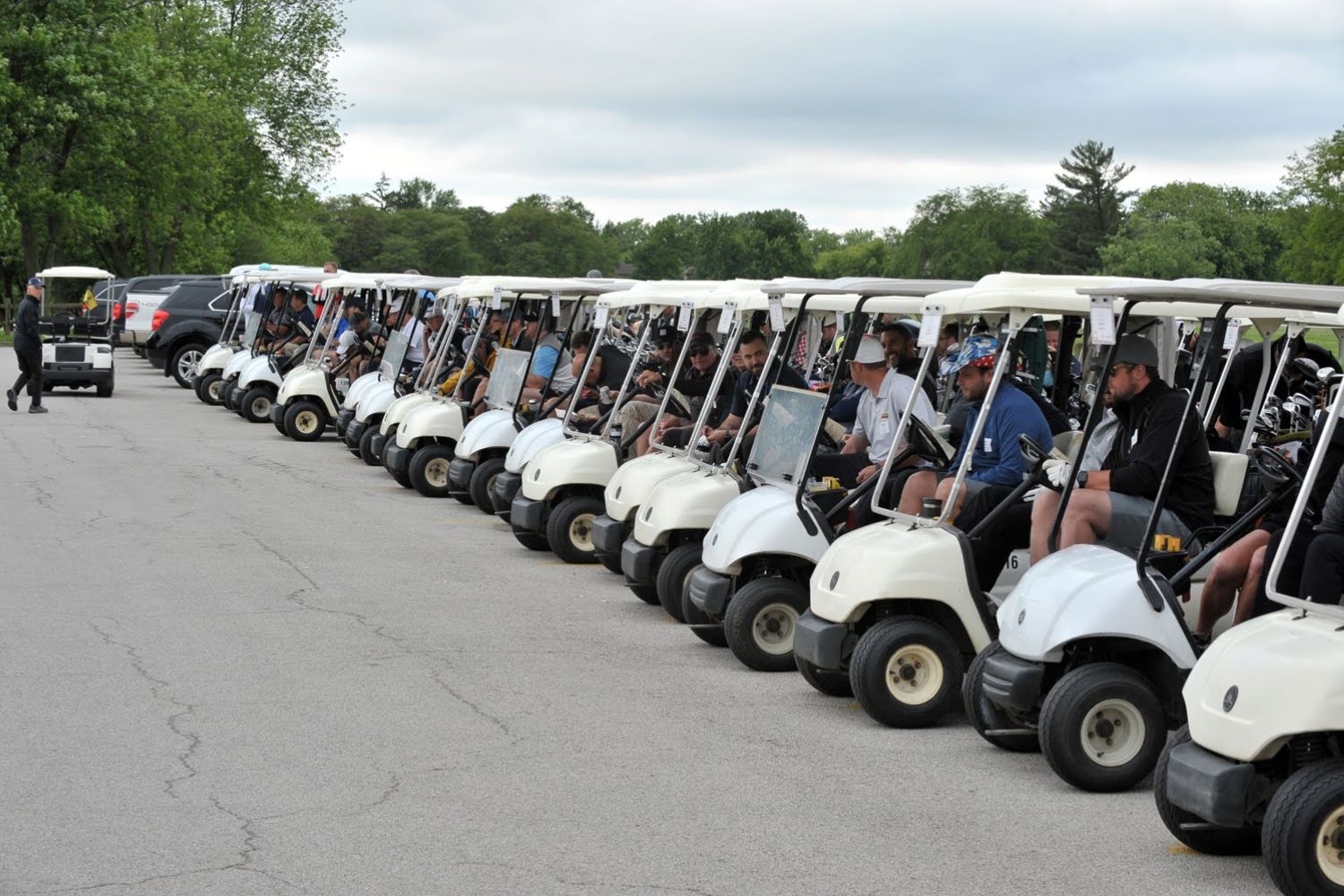 team in golf carts row