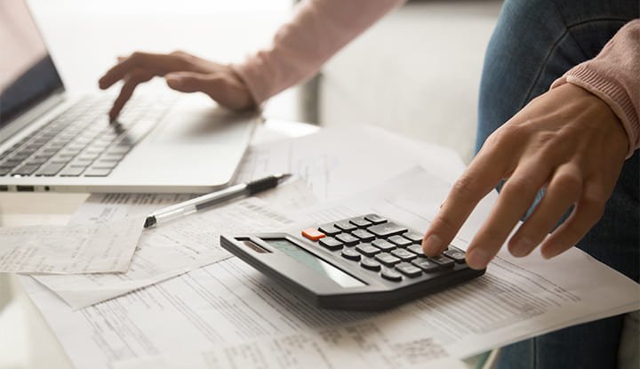 a person using a calculator