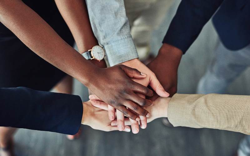 Top view of a business team holding hands