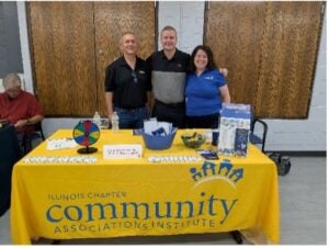three smiling team members at a Vibrant Living Expo booth