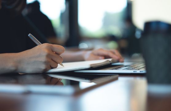 close-up of business woman with paperwork and pen